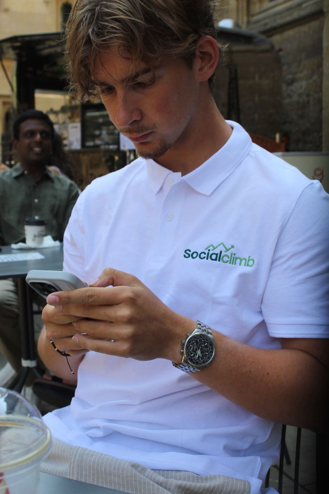Social Climb team member reviewing footage on set